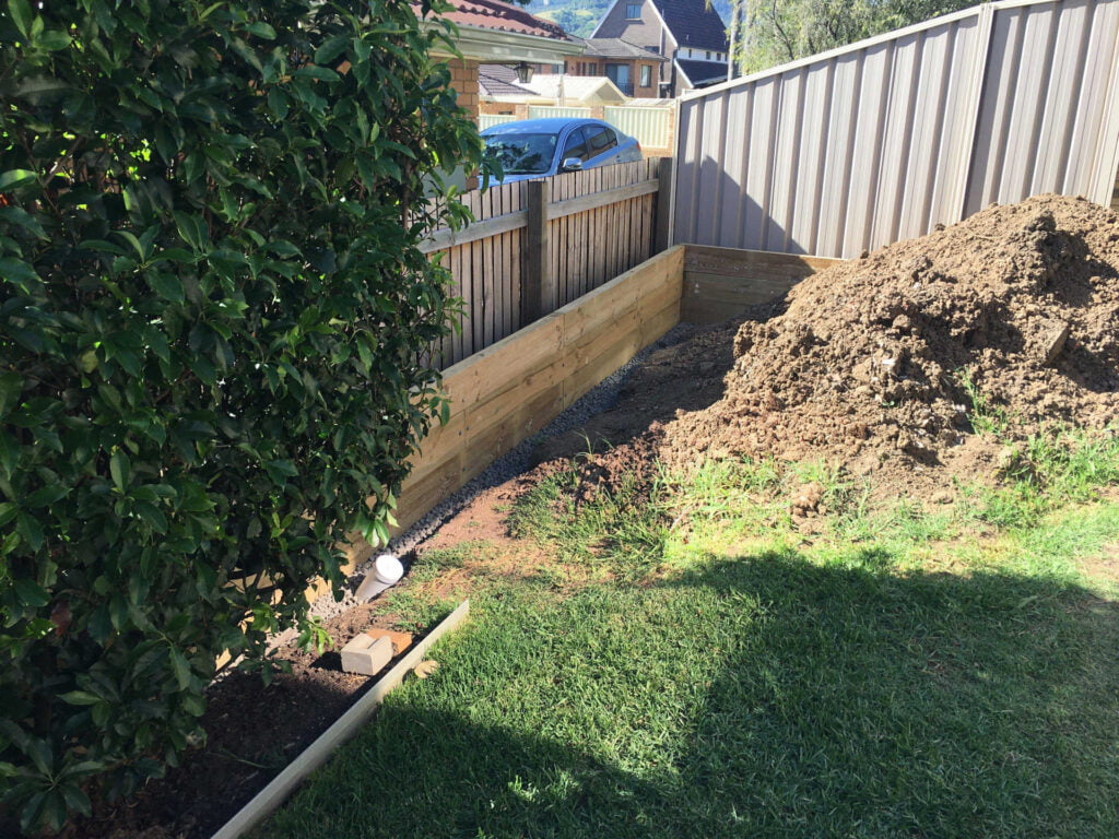 Treated Pine Retaining Wall with drainage installed ready for back filling in Figtree Wollongong New South Wales