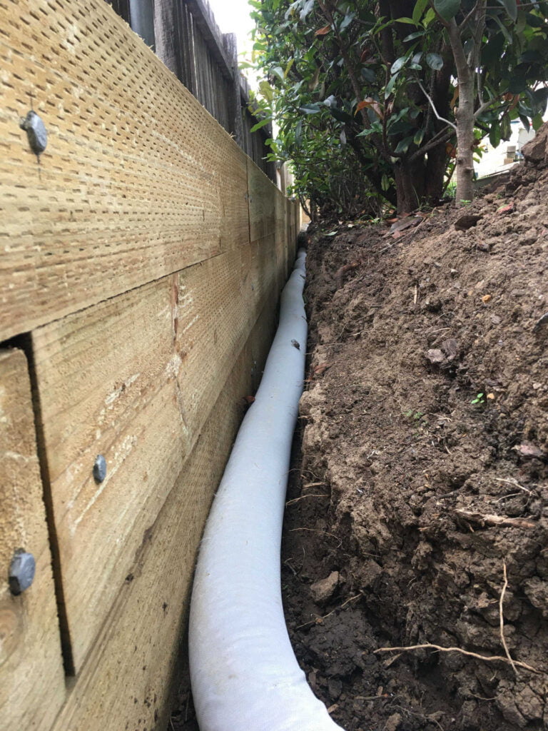 Treated Pine Retaining Wall with drainage installed ready for back filling in Figtree Wollongong New South Wales